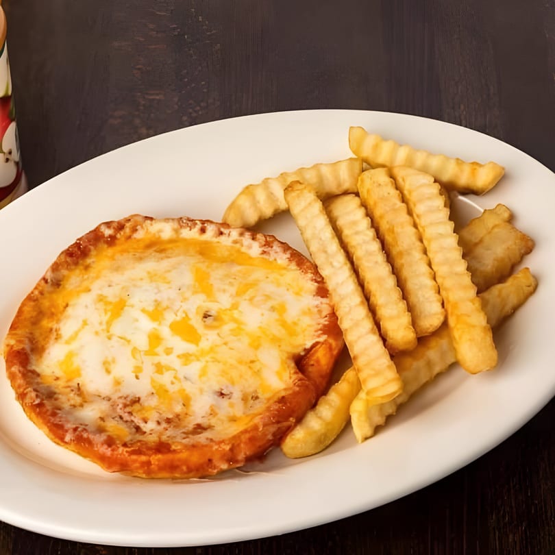 Melted cheese dish with crinkle-cut fries on a white plate at Toro Loco.